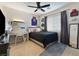 Well-lit bedroom with dark gray accents, carpet flooring and ceiling fan at 5131 Moose Falls Dr, Las Vegas, NV 89141