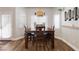 Bright dining room featuring a rustic dining table and natural light at 5131 Moose Falls Dr, Las Vegas, NV 89141