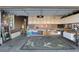 Functional garage with ample storage cabinets and a workbench, providing space for projects and organization at 5131 Moose Falls Dr, Las Vegas, NV 89141