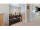 Hallway features wooden railing, a console table and neutral walls at 5131 Moose Falls Dr, Las Vegas, NV 89141