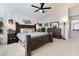Spacious main bedroom boasts modern decor, a ceiling fan, and serene ambiance at 5131 Moose Falls Dr, Las Vegas, NV 89141