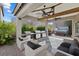 Outdoor space featuring multiple grills, ceiling fans, seating, and a spa at 5131 Moose Falls Dr, Las Vegas, NV 89141
