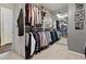 Large walk-in closet with custom organizers and a full length mirror at 5131 Moose Falls Dr, Las Vegas, NV 89141