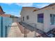 Cozy single story home with small yard, side yard with concrete walkway to the backyard at 519 Landra Ln, Henderson, NV 89015