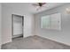 Cozy bedroom with carpet, window, ceiling fan, and closet at 519 Landra Ln, Henderson, NV 89015