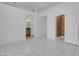 Spacious bedroom with modern tile flooring and walk-in closet at 519 Landra Ln, Henderson, NV 89015