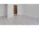 Bright bedroom boasts tile flooring and a walk-in closet at 519 Landra Ln, Henderson, NV 89015