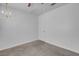 Carpeted bedroom featuring chandelier and standard door at 519 Landra Ln, Henderson, NV 89015