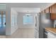 Breakfast nook with views of the pool, stainless steel appliances, and modern chandelier at 519 Landra Ln, Henderson, NV 89015