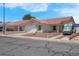 Well-maintained single-story house showcasing a two-car garage and desert landscaping at 519 Landra Ln, Henderson, NV 89015