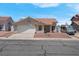 Charming single-story home featuring a well-manicured front yard and a two-car garage at 519 Landra Ln, Henderson, NV 89015