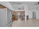 Spacious open concept kitchen with an adjacent fireplace and stainless steel appliances at 519 Landra Ln, Henderson, NV 89015