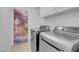 Laundry room with modern washer and dryer units at 519 Landra Ln, Henderson, NV 89015