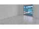 Bright living room showcasing access to outdoor pool area through sliding glass doors at 519 Landra Ln, Henderson, NV 89015