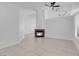 Bright living room with a fireplace and tile flooring, offering a comfortable and inviting space at 519 Landra Ln, Henderson, NV 89015