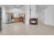 Open living area with a fireplace, tile flooring, and seamlessly connected to the kitchen at 519 Landra Ln, Henderson, NV 89015