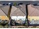 Aerial view of a home featuring a backyard oasis with a pool, fire pit, and lush landscaping at 599 Wounded Star Ave, Las Vegas, NV 89178