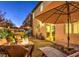 Inviting backyard featuring a stone patio, fire pit, waterfall feature, and comfortable lounge seating at 599 Wounded Star Ave, Las Vegas, NV 89178