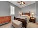 Cozy bedroom featuring a king-sized bed, wooden furniture, and soft lighting at 599 Wounded Star Ave, Las Vegas, NV 89178