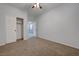 Inviting bedroom with plush carpet, neutral walls, and ample natural light at 599 Wounded Star Ave, Las Vegas, NV 89178