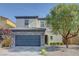 Charming two-story home featuring a stone accented facade and a well-maintained front yard at 599 Wounded Star Ave, Las Vegas, NV 89178