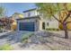 Charming two-story home featuring a stone accented facade and a well-maintained front yard at 599 Wounded Star Ave, Las Vegas, NV 89178