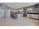 Spacious kitchen with a large island, stainless steel appliances and stylish wooden accent wall at 599 Wounded Star Ave, Las Vegas, NV 89178