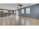 Bright living room with tile floors, open to the kitchen with a breakfast bar at 599 Wounded Star Ave, Las Vegas, NV 89178