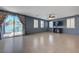 Bright living room featuring tile floors and a sliding glass door leading to the backyard at 599 Wounded Star Ave, Las Vegas, NV 89178