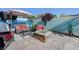 Landscaped patio featuring comfortable seating around a fire pit, perfect for outdoor relaxation at 599 Wounded Star Ave, Las Vegas, NV 89178