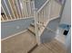 Carpeted staircase with white railing, leading to the upper level of the home at 599 Wounded Star Ave, Las Vegas, NV 89178