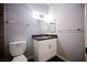 Bathroom with white vanity, black granite countertop, toilet and neutral paint at 6006 Vegas Dr, Las Vegas, NV 89108