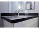 Bathroom with white vanity, black granite countertop, toilet and neutral paint at 6006 Vegas Dr, Las Vegas, NV 89108