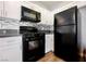 Spacious kitchen boasts modern appliances, light countertops, stylish backsplash, and ample cabinet space at 6006 Vegas Dr, Las Vegas, NV 89108