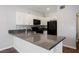 Well-equipped kitchen featuring granite counters, stainless steel appliances, and white cabinetry at 6006 Vegas Dr, Las Vegas, NV 89108