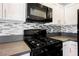 Modern kitchen showcases updated appliances, stylish backsplash, bright lighting, and sleek countertops at 6006 Vegas Dr, Las Vegas, NV 89108