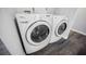 A white front loading Whirlpool washer and dryer are located in this home's laundry room at 6006 Vegas Dr, Las Vegas, NV 89108