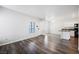 Inviting living area featuring neutral walls, ceiling fan, and wood-look floors at 6006 Vegas Dr, Las Vegas, NV 89108