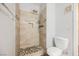 Bathroom with tiled shower, pebble floor, shower caddy and neutral paint at 6006 Vegas Dr, Las Vegas, NV 89108