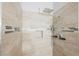 Shower with tiled walls, tiled accent, shower caddy and neutral paint at 6006 Vegas Dr, Las Vegas, NV 89108