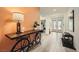 Stylish entryway featuring wood-look flooring, a unique bicycle console table, and natural light at 6098 Avery Pointe St, Las Vegas, NV 89166