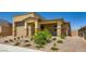 Inviting front exterior showcasing desert landscaping, a covered entryway, and a neutral color scheme at 6098 Avery Pointe St, Las Vegas, NV 89166