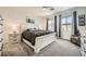 Inviting main bedroom with a comfortable bed, side tables, and calming decor under a ceiling fan, creating a relaxing retreat at 6098 Avery Pointe St, Las Vegas, NV 89166