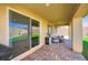 Comfortable covered patio with brick flooring, perfect for outdoor dining and relaxation at 6098 Avery Pointe St, Las Vegas, NV 89166