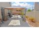 A covered patio area provides outdoor entertaining space in this home's backyard at 6098 Darkfeather Way, Las Vegas, NV 89139