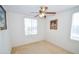 Cozy bedroom with carpet flooring, ceiling fan and bright window at 6098 Darkfeather Way, Las Vegas, NV 89139