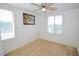 Carpeted bedroom featuring a ceiling fan and bright windows at 6098 Darkfeather Way, Las Vegas, NV 89139