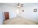 Bedroom with plush carpet flooring, ceiling fan, and ample natural light at 6098 Darkfeather Way, Las Vegas, NV 89139