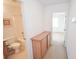 Hallway leading to a bathroom and bedroom with built-in storage at 6098 Darkfeather Way, Las Vegas, NV 89139