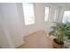 Bright hallway with large windows and plant, creating a welcoming and airy transition space at 6098 Darkfeather Way, Las Vegas, NV 89139
